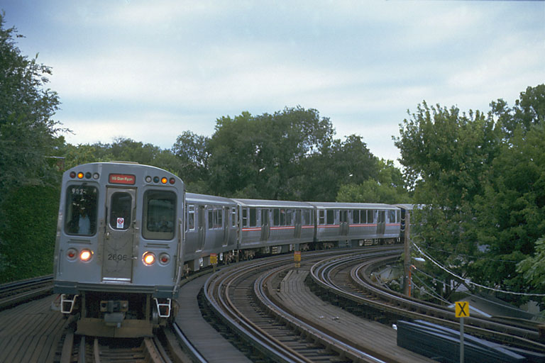  Car 2606 leads an eight-car mixed train of 2400s and 2600s as it rounds the 